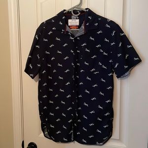 Casual button up shirt, blue in color with airplane pattern
